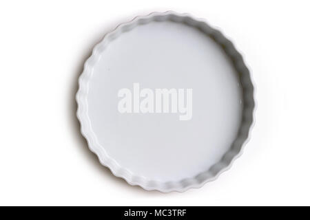 Empty ceramic tart or pie dish, on white background; with copy space Stock Photo