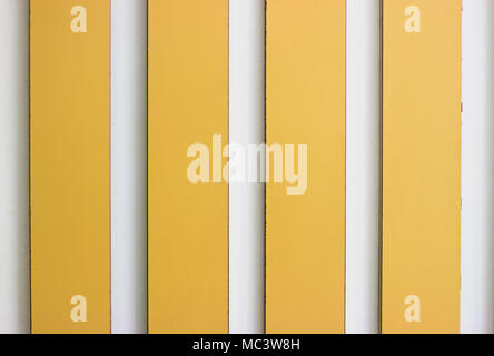 Decorative yellow and white stripe panels on the wall Stock Photo
