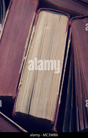 Top view of a stack of old hard back books Stock Photo