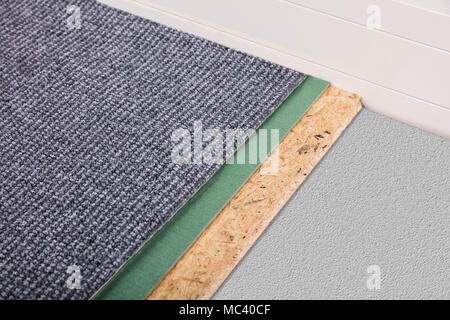 High Angle View Of A New Grey Carpet Corner Stock Photo