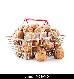 Walnuts in shopping basket, unpeeled walnut heap as healthy eating and dieting concept, objects group isolated on white background clipping path inclu Stock Photo