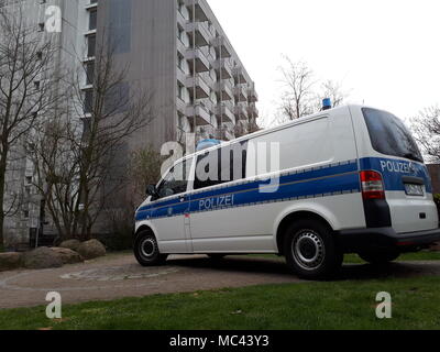 11 April 2018, Germany, Hamburg: A marked police van parks in front of a hostel. Federal police and customes have conducted police raids in a large-scale operation against the trafficing of illegal foreign construction workers across several German states inclduing Lower Saxony, Bremen, Hamburg and Schleswig-Holstein. Photo: Telenewsnetwork/dpa Stock Photo