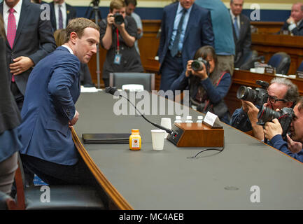 Mark Zuckerberg, Co-Founder and CEO of Facebook, returns to his seat to resume his testimony before a meeting of the United States House Committee on Energy and Commerce during a hearing on 'Facebook: Transparency and Use of Consumer Data,' on Capitol Hill in Washington, DC on Wednesday, April 11, 2018. Credit: Ron Sachs/CNP (RESTRICTION: NO New York or New Jersey Newspapers or newspapers within a 75 mile radius of New York City) -NO WIRE SERVICE- Photo: Ron Sachs/Consolidated/dpa Stock Photo