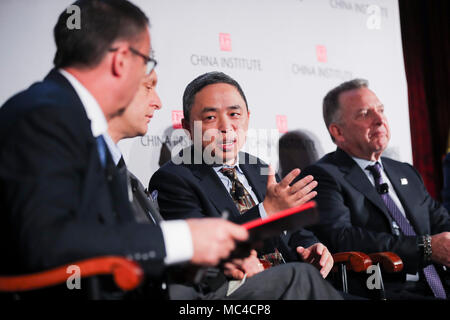 New York, USA. 12th Apr, 2018. Ni Pin (2nd R), president of Wanxiang America Corporation, the Chicago-based arm of Wanxiang Group Company, speaks during a panel discussion at the China Institute 2018 Executive Summit, 'U.S.-China Business in the New World Order,' in New York, the United States, April 12, 2018. The United States must avoid overusing national security review plea and ensure a level playing field and a predictable environment for Chinese enterprises investment in the country, experts said here on Thursday. Credit: Wang Ying/Xinhua/Alamy Live News Stock Photo