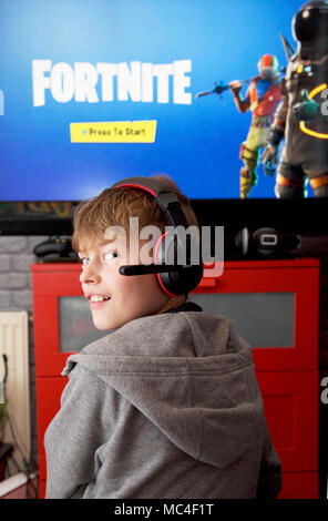 Teenager Playing Fortnite Video Game Fortnite Is An Internet Based - a boy plays fortnite battle royale on his xbox one stock photo