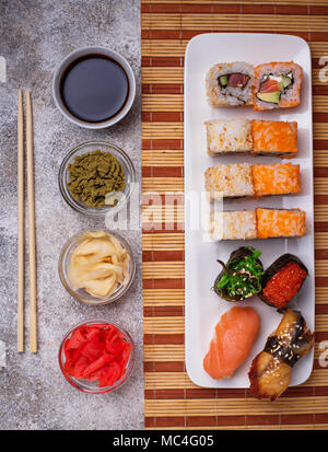 Sushi roll set with wasabi, ginger and soy sauce .  Stock Photo