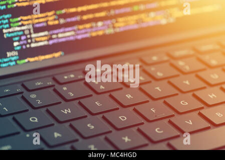 Closeup coding on screen, hands coding html and programming on screen laptop, web development, developer Stock Photo