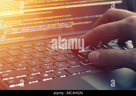 Closeup coding on screen, hands coding html and programming on screen laptop, web development, developer Stock Photo