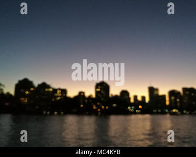 Defocused abstract cityscape with evening river scene of Brisbane City Australia Stock Photo