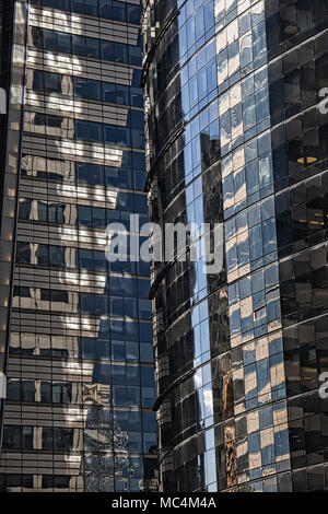Contemporary glass and steel high-rise reflecting office buildings in Midtown Manhattan, New York USA Stock Photo