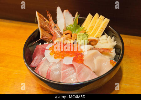 Full bowl of fresh Japanese seafood platter on rice Stock Photo