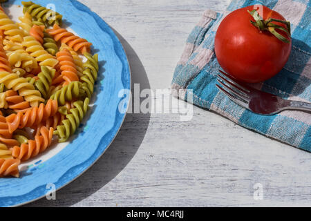 Delicious homemade colorful pasta whit meat sauce and fresh tomato at ...