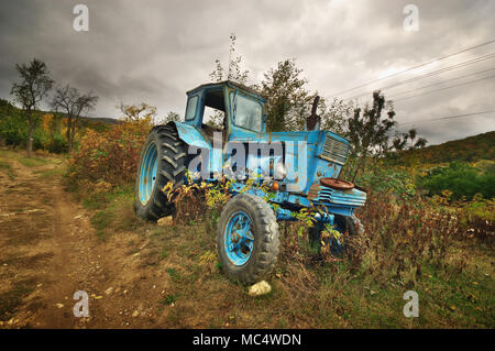 old abandoned rusty tractor Stock Photo