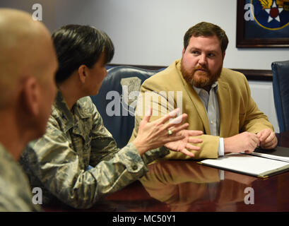 Col. Debra Lovette, 81st Training Wing commander, briefs David Allen, legislative assistant for Congressman Steven Palazzo, on Keesler training capabilities during an 81st Training Wing mission brief at the headquarters building Jan. 26, 2018, on Keesler Air Force Base, Mississippi. Allen visited Keesler to learn more about the base and on-going construction projects that impact the local community, like the Division Street Gate which will begin construction this summer. (U.S. Air Force photo by Kemberly Groue) Stock Photo