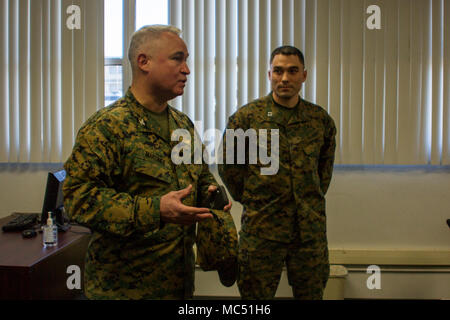 Col. Ricardo Martinez, chief of staff, Marine Air Ground Task Force Training Command, Marine Corps Air Ground Combat Center, speaks to Marines with the Fleet Assistance Program at the opening of the Tax Center aboard MCAGCC, alongside Capt. Adam LoCascio, officer in charge of the Tax Center, Legal Services Support Team, Headquarters Battalion, Jan. 29, 2018. The Tax Center offers free assistance to Marines during Tax season. (U.S. Marine Corps photo by Pfc. Rachel K. Porter) Stock Photo