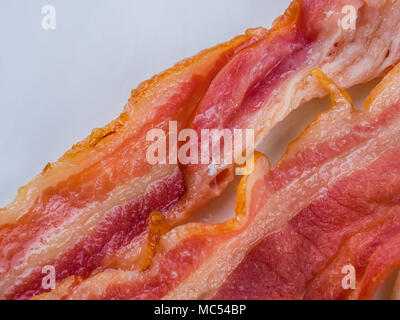 Fresh crispy bacon slices. macro shot. food background. Top view Stock Photo