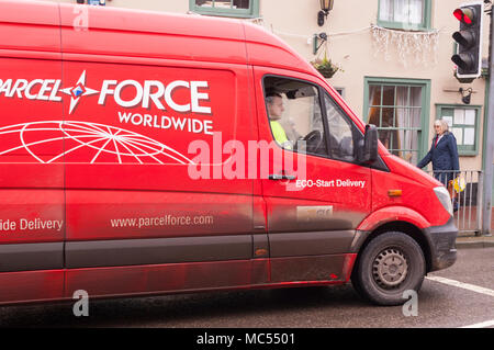 A Parcel Force delivery driver at work in Holt , Norfolk , England , Uk Stock Photo