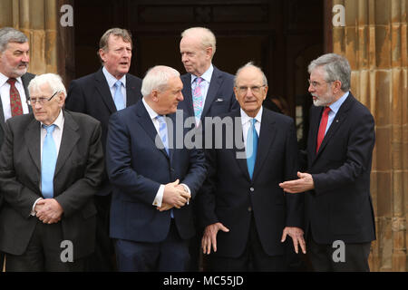 Lord John Alderdice, Lord David Trimble, Sir Reg Empey, (back row left to right) & Monica McWilliams, Seamus Mallon, former Taoiseach Mr Bertie Ahern, Senator George J. Mitchell, Gerry Adams pose for a photo outside  at  Queen's University Belfast, Tuesday, April 10th, 2018. Tuesday marks 20 years since politicians from Northern Ireland and the British and Irish governments agreed what became known as the Good Friday Agreement. It was the culmination of a peace process which sought to end 30 years of the Troubles. Two decades on, the Northern Ireland Assembly is suspended in a bitter atmospher