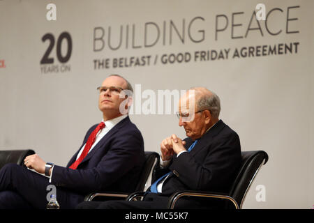 Irish Foreign Affairs Minister Simon Coveney sits beside former US Senator George Mitchell  at  Queen's University Belfast, Tuesday, April 10th, 2018. Tuesday marks 20 years since politicians from Northern Ireland and the British and Irish governments agreed what became known as the Good Friday Agreement. It was the culmination of a peace process which sought to end 30 years of the Troubles. Two decades on, the Northern Ireland Assembly is suspended in a bitter atmosphere between the two main parties. Stock Photo