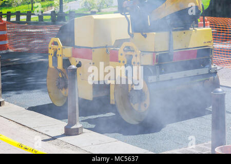 Close view on the road roller working on the new road construction site Stock Photo