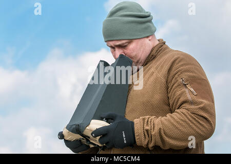 RQ-20 Puma is a small unmanned aircraft system developed by AeroVironment for United States military reconnaissance and surveillance operations. A remote control operation was conducted during multinational training at Grafenwoehr, Germany on April 2, 2018 in preparation for a Robotic Complex Breach Concept demonstration. The archival image documents ground control operation of a hand-launched unmanned aerial system. Stock Photo