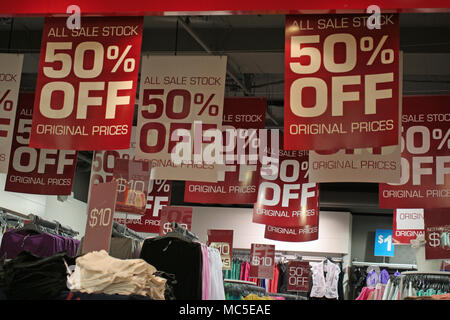 WOMEN'S CLOTHING SHOP OFFERING 50% SALE ON ORIGINAL PRICE OF STOCK. SYDNEY, NSW, AUSTRALIA. Stock Photo