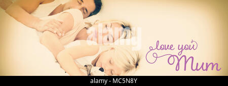 Composite image of family sleeping together Stock Photo