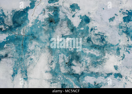 Grunge blue painted cracking wall texture background. Stock Photo