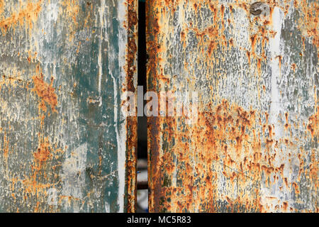 A pair of colourful metal but rusty gates seen in eastern Beijing, China, attract attention Stock Photo