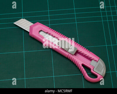 Knife cutter , put on  Blue rubber flooring Stock Photo