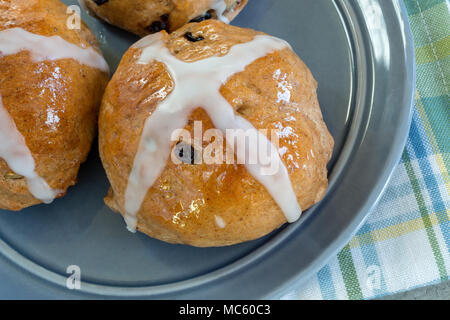 Authentic homemade hot cross buns from the home kitchen. Stock Photo