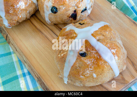 Authentic homemade hot cross buns from the home kitchen. Stock Photo