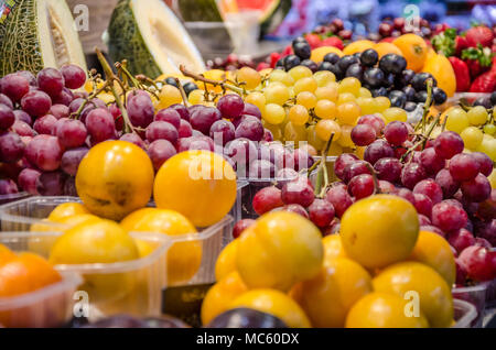 Fresh fruit on display for sale on a market stall. Stock Photo