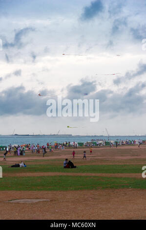 Kites flying on beach Galle Face Green in Colombo Sri Lanka Stock Photo