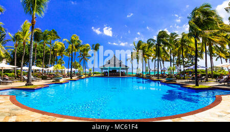 Luxury relax in Mauritius island,view with swimming pooland palm trees. Stock Photo