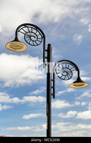 A typical street light in Lyme Regis with the characteristic ammonite design. Stock Photo