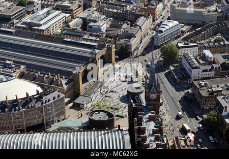 aerial view of commuters & people outside London St Pancras & Kings Cross Stations, London