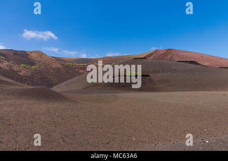 Volcanoes near the trekking route in Timanfaya National Park on Lanzarote, the Canary Islands, Spain Stock Photo