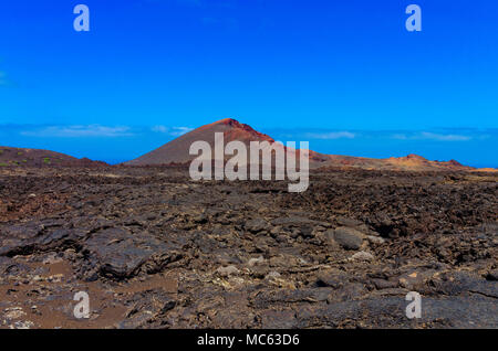 Volcanoes near the hiking trail in Timanfaya National Park on Lanzarote, the Canary Islands Stock Photo