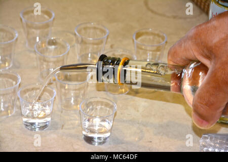 Pouring Arak into glasses Stock Photo Alamy