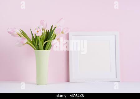 Blank white square picture frame with pink tulips Stock Photo