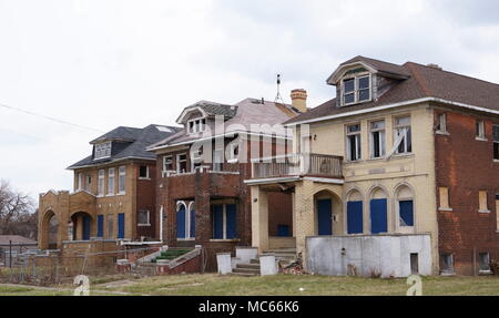 Abandoned houses in an empty street deserted in Detroit. Stock Photo