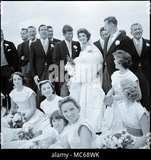 Jackie Bouvier Kennedy and John F. Kennedy, in wedding attire, with members of their wedding party - September 12, 1953 Stock Photo