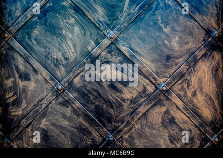 Colorful metal brushed texture with rivets. Stock Photo