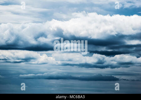 Multiple layers of ominous storm clouds. Stock Photo