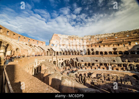 Rome, October 2017: Tourists visiting the interior of the iconic monument Colosseum, one of the New Seven Wonders of the World, on October 2017 in Rom Stock Photo