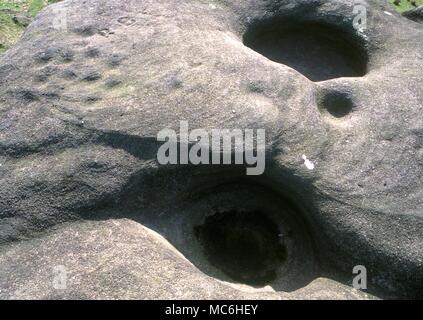 Ley Lines. The Doubler Stones on Ilkley Moor, Yorkshire. These stones were a sacred site in prehistoric times and part of an extensive ley. Prehistoric markings and manmade water holes Stock Photo