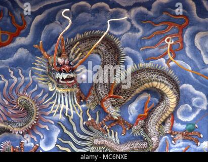 Chinese dragon - Semi-relief Haw Par Villa in Singapore - against blue sea Stock Photo