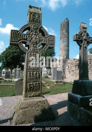 Celtic Crosses - Monasterboice - The 10th century South Cross at Monasterboice, with The Last Judgement in the central boss of the cross. Christ holds the cross and the flowering rod. The cross is 18 feet high: sometimes called Muiredach's Cross.- Â® / Charles Walker Stock Photo