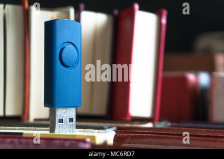 Memorization of knowledge books and organizer are near the blue stick on the table symbolizing. Stack books on wooden background. Back to school with  Stock Photo